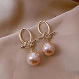 Ohrringe mit rosa Perle und Knoten