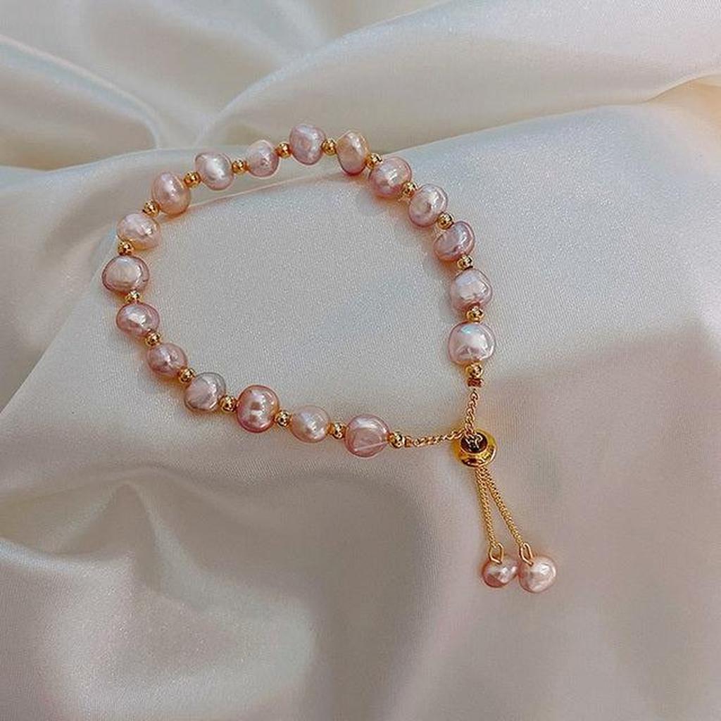 Armband mit rosa Margerite in Gold