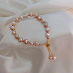 Armband mit rosa Margerite in Gold