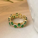 Offener Ring Calira mit smaragdgrünem Stein in Gold