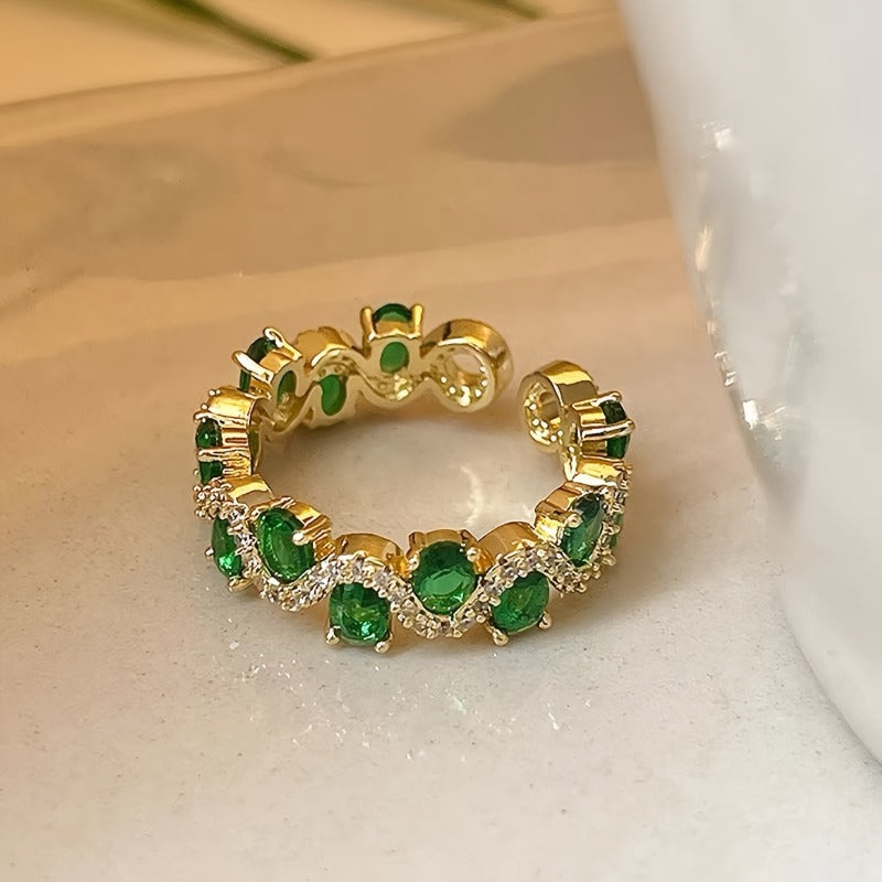 Offener Ring Calira mit smaragdgrünem Stein in Gold