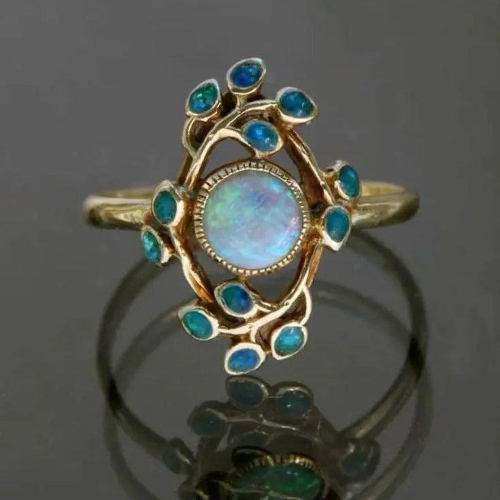 Blauer Retro-Ring mit Kristallen und Opal