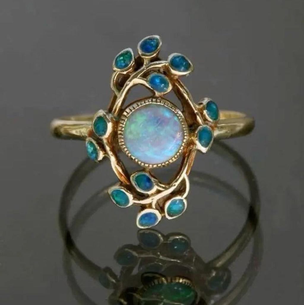 Blauer Retro-Ring mit Kristallen und Opal