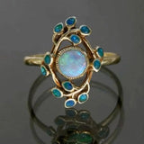 Blauer Retro-Ring mit Kristallen und Opal