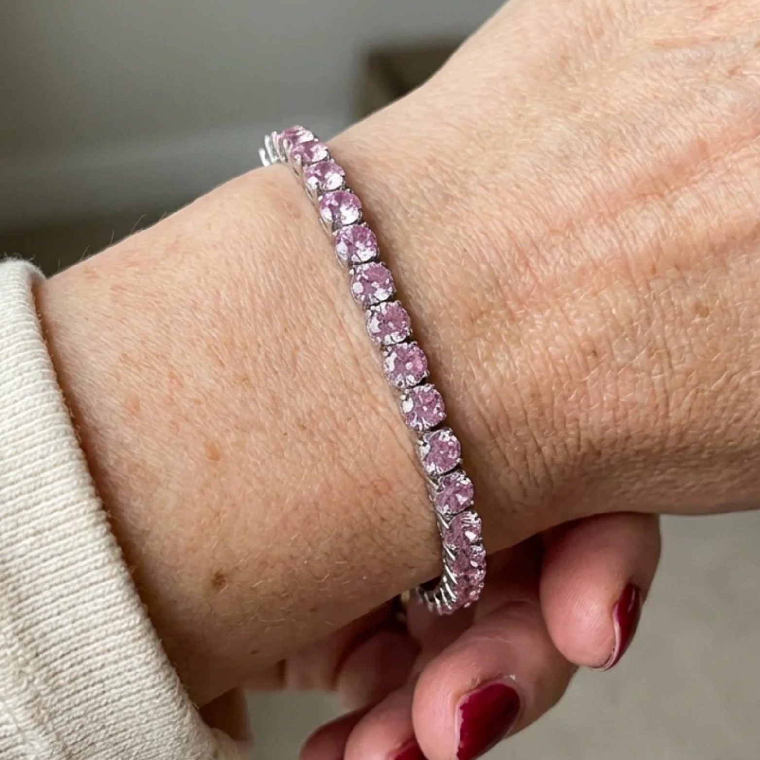 Tennisarmband mit rosa Saphir in Weißgold
