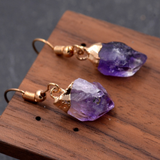 Goldene Ohrringe mit Amethyst