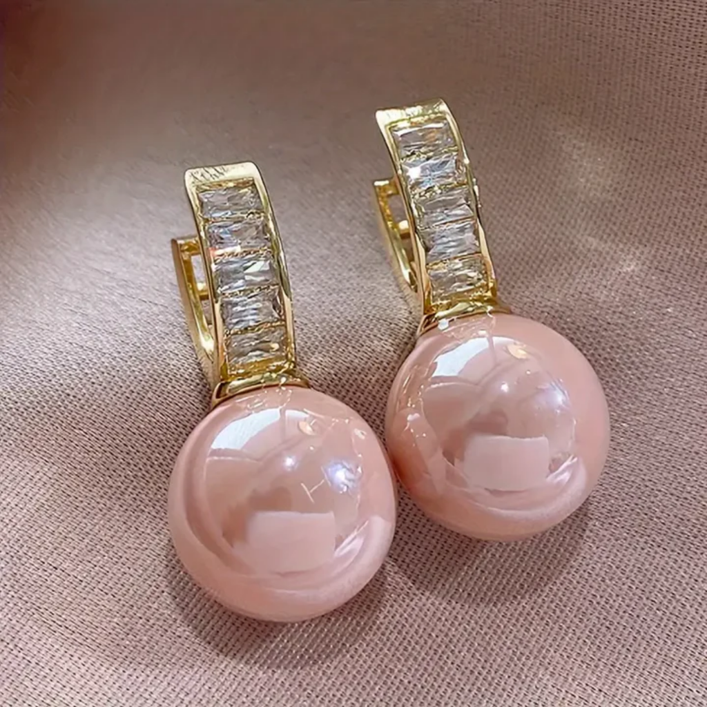 Goldene Ohrringe mit rosa Perle und Zirkonia
