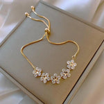 Margeritenarmband mit Kristall in Gold