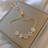 Margeritenarmband mit Kristall in Gold