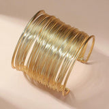 Offenes Armband mit Spirale in Gold