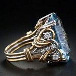 Retro-Goldring mit mehrreihigen blauen Zirkonia