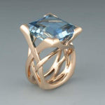 Retro-Ring in Roségold mit blauen Zirkonia