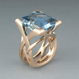 Retro-Ring in Roségold mit blauen Zirkonia