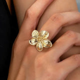Ring „Sonnenaufgang“ mit Blume in Gold
