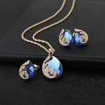 Set: Halskette und Ohrringe mit blauem Kristall in Gold