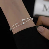 Weißgold-Armband mit Sternen
