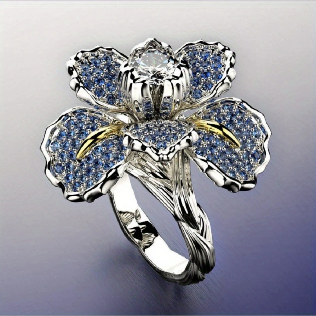 Weißgoldring mit blauen Blüten und Kristall