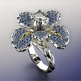 Weißgoldring mit blauen Blüten und Kristall