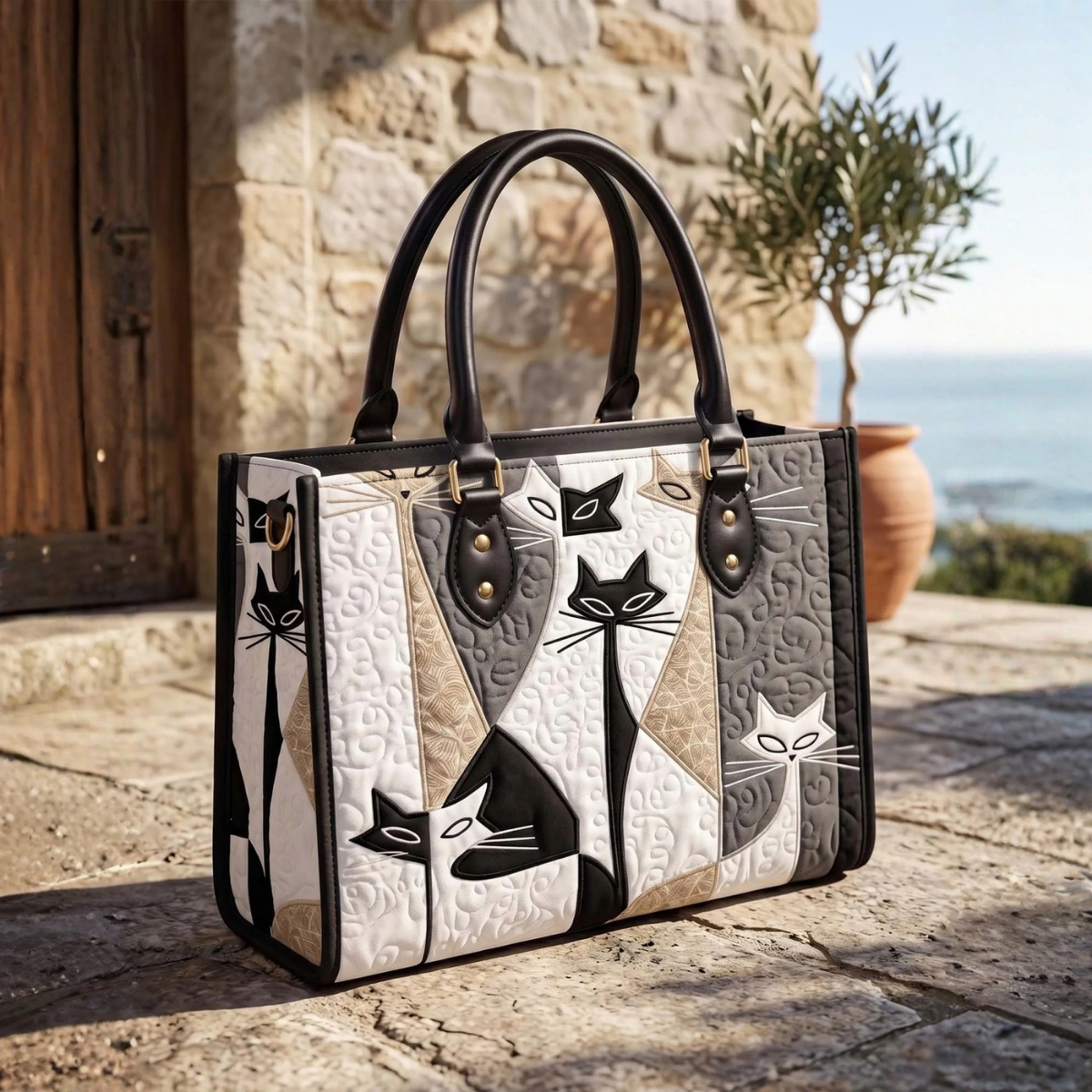 Stepptasche Kunstkatze – gesteppte Henkeltasche für Damen
